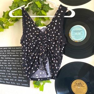 black floral tank top, can be adjusted to be cropped or not.